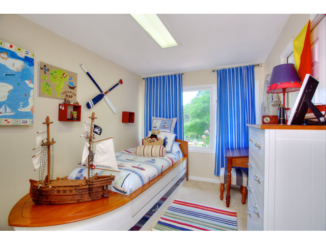 3 Spring Valley Lane Millbrae, CA 94030 - Photo 11 of 16 a bed room with a bed and a couch