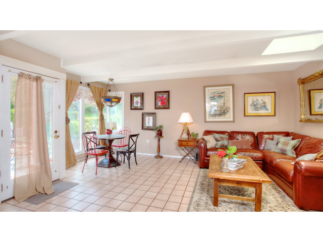 3 Spring Valley Lane Millbrae, CA 94030 - Photo 7 of 16 a living room with furniture and a large window
