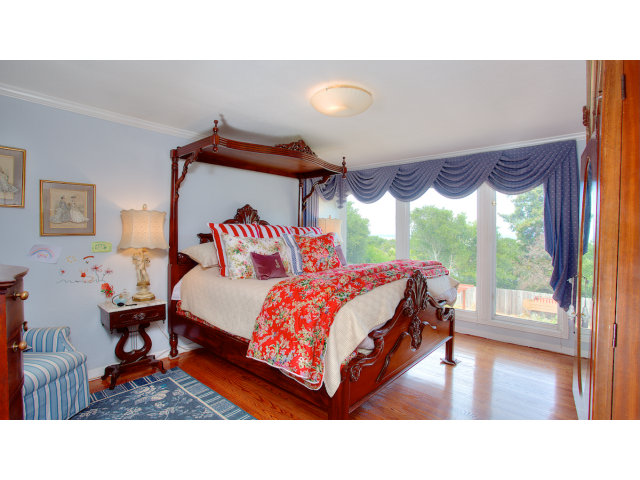 3 Spring Valley Lane Millbrae, CA 94030 - Photo 9 of 16 a bedroom with a bed and a large window