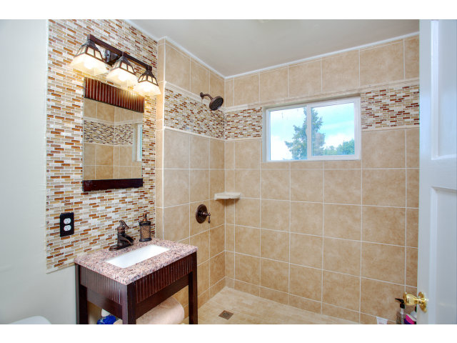 3 Spring Valley Lane Millbrae, CA 94030 - Photo 10 of 16 a bathroom with a sink mirror and shower