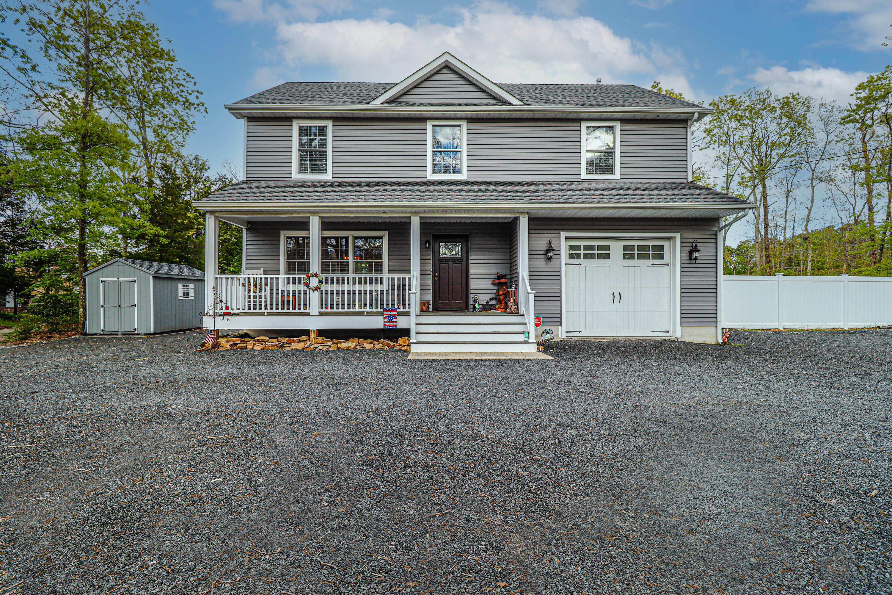 10 Letts Landing Road Waretown, NJ 08758 - Photo 1 of 51 a front view of a house with garage