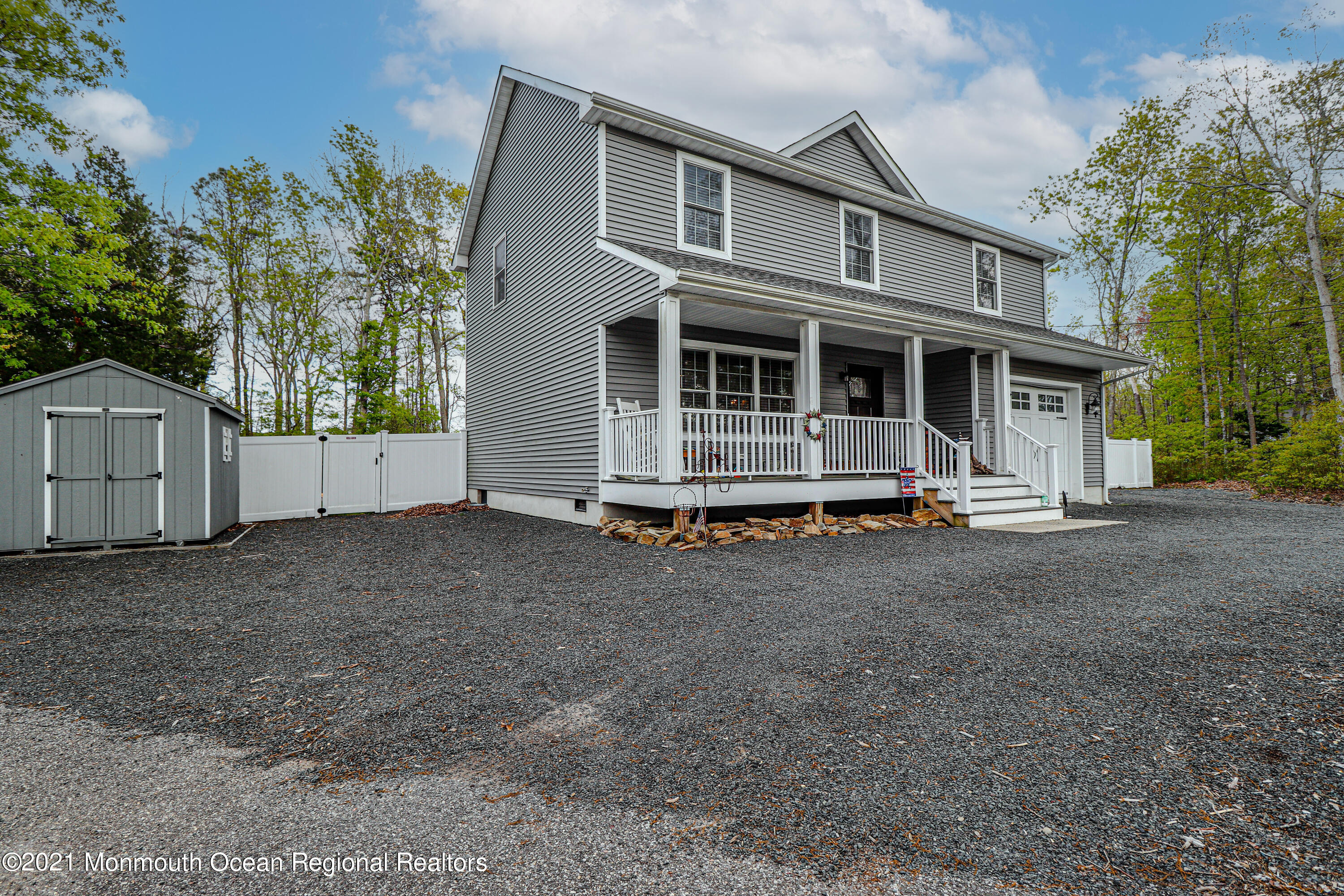 10 Letts Landing Road Waretown, NJ 08758 - Photo 2 of 51 a front view of a house with a yard