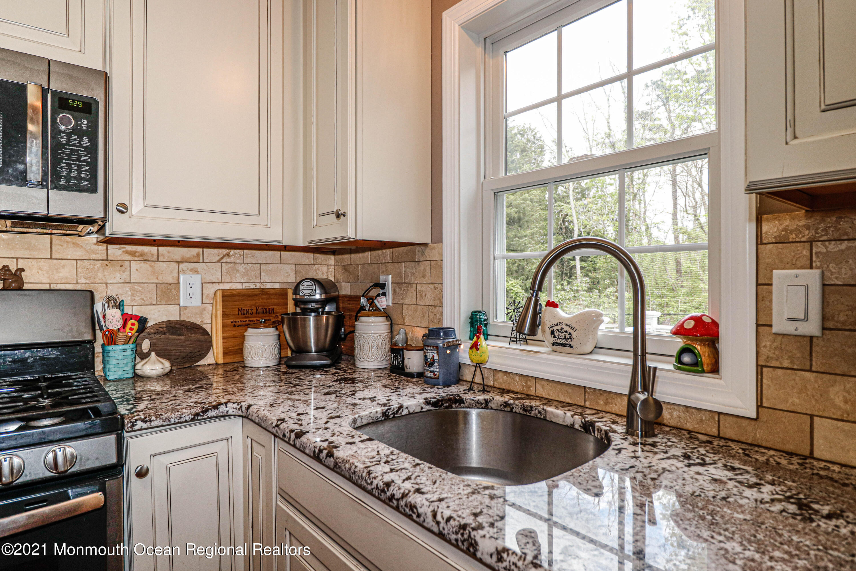 10 Letts Landing Road Waretown, NJ 08758 - Photo 16 of 51 a kitchen with granite countertop a sink and a stove top oven