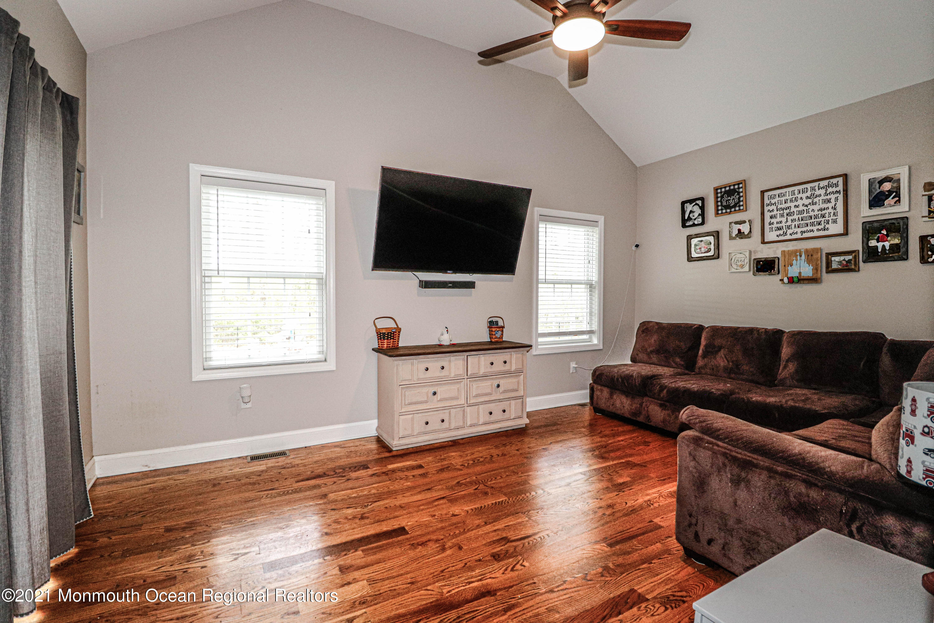 10 Letts Landing Road Waretown, NJ 08758 - Photo 18 of 51 a living room with furniture and a flat screen tv