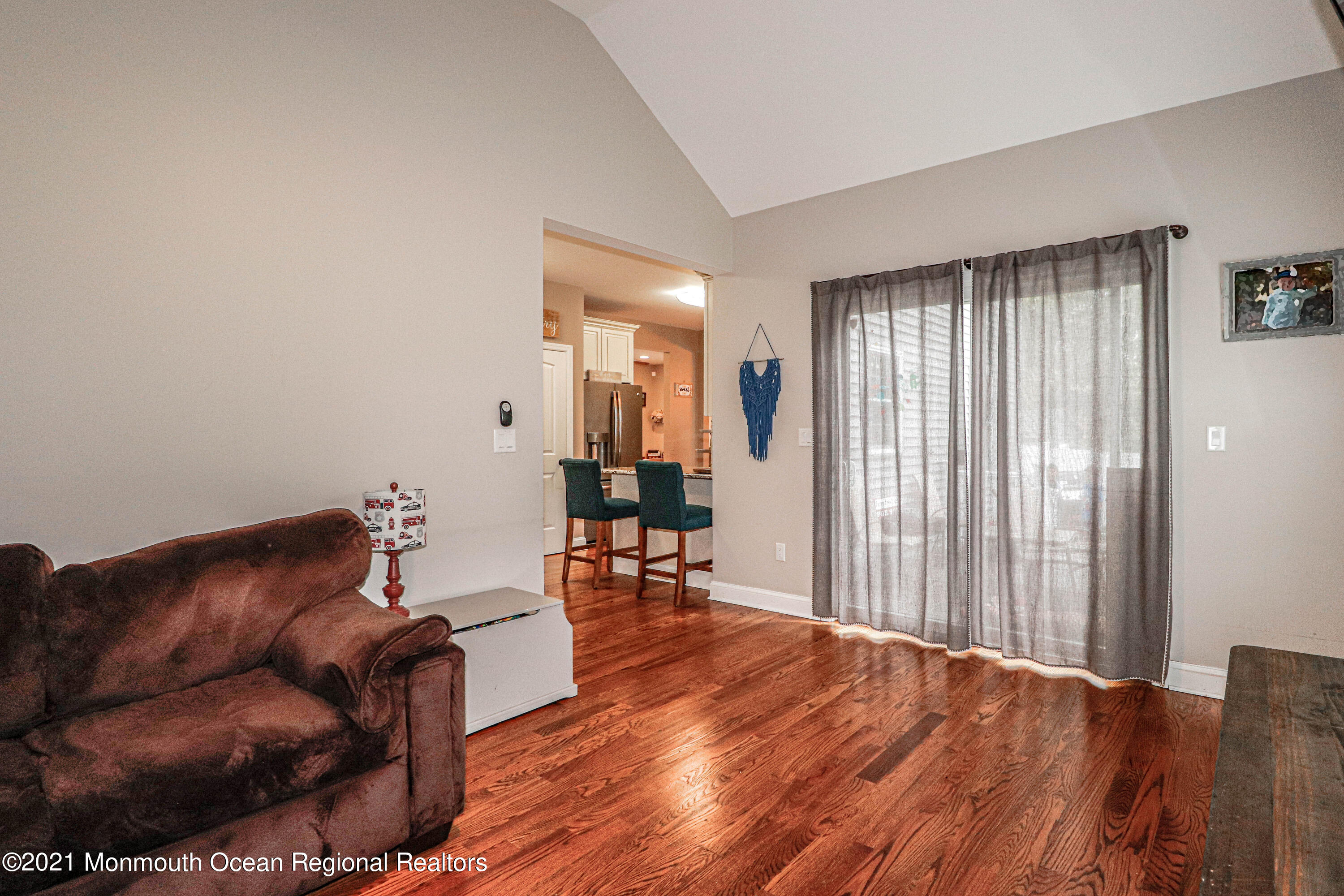10 Letts Landing Road Waretown, NJ 08758 - Photo 19 of 51 a living room with furniture and wooden floor