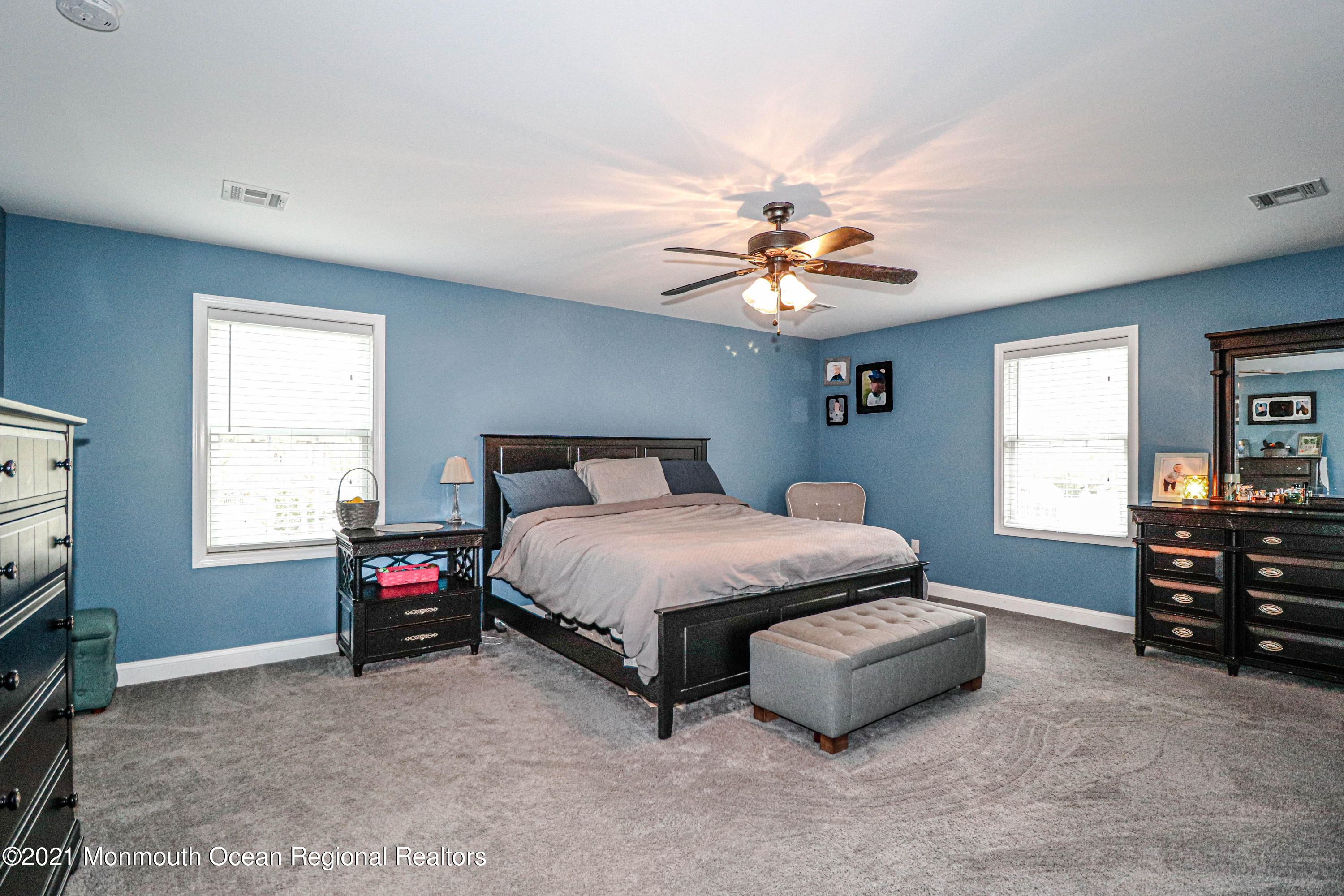 10 Letts Landing Road Waretown, NJ 08758 - Photo 25 of 51 a spacious bedroom with a bed and a chandelier