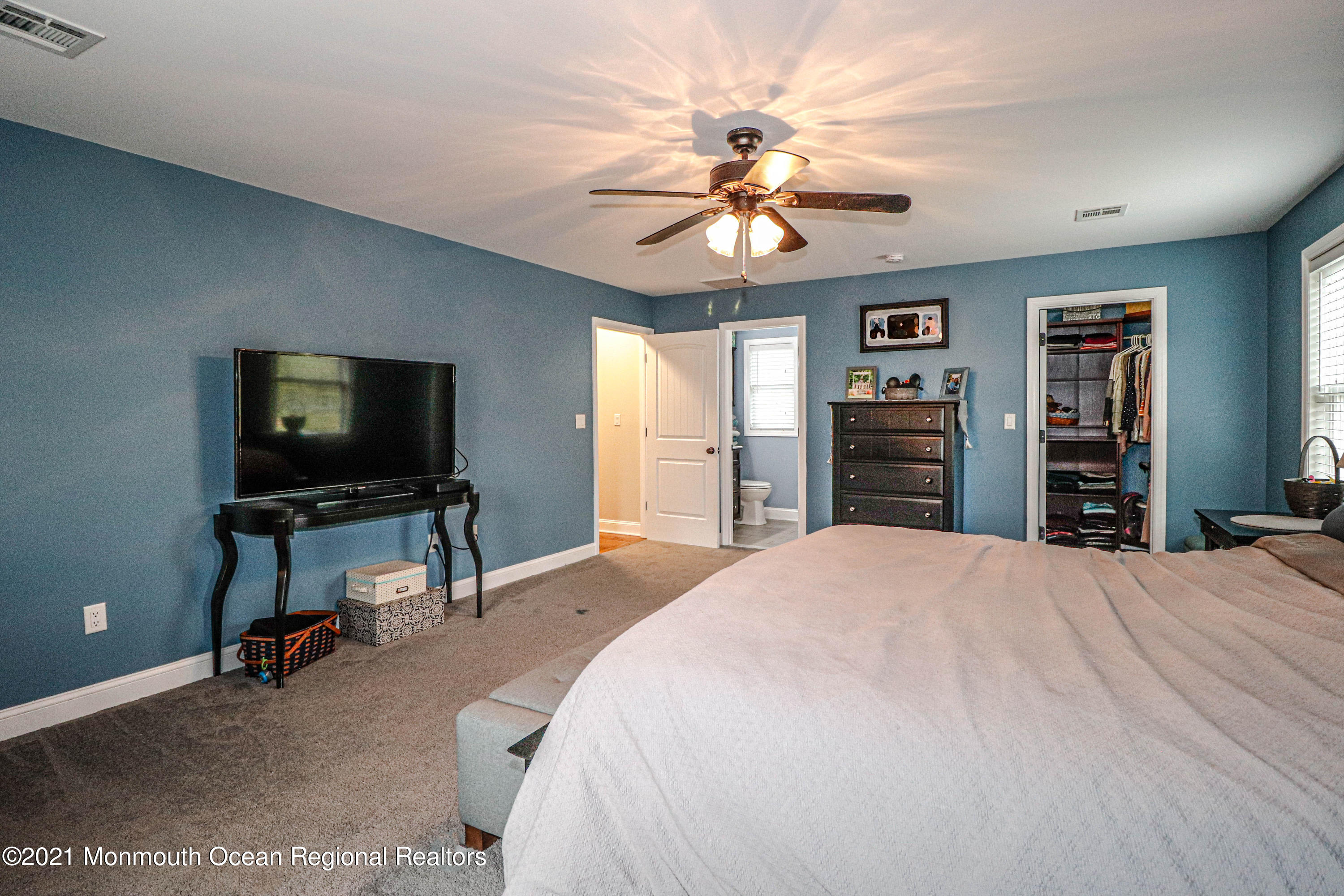 10 Letts Landing Road Waretown, NJ 08758 - Photo 26 of 51 a bedroom with a bed and a flat screen tv