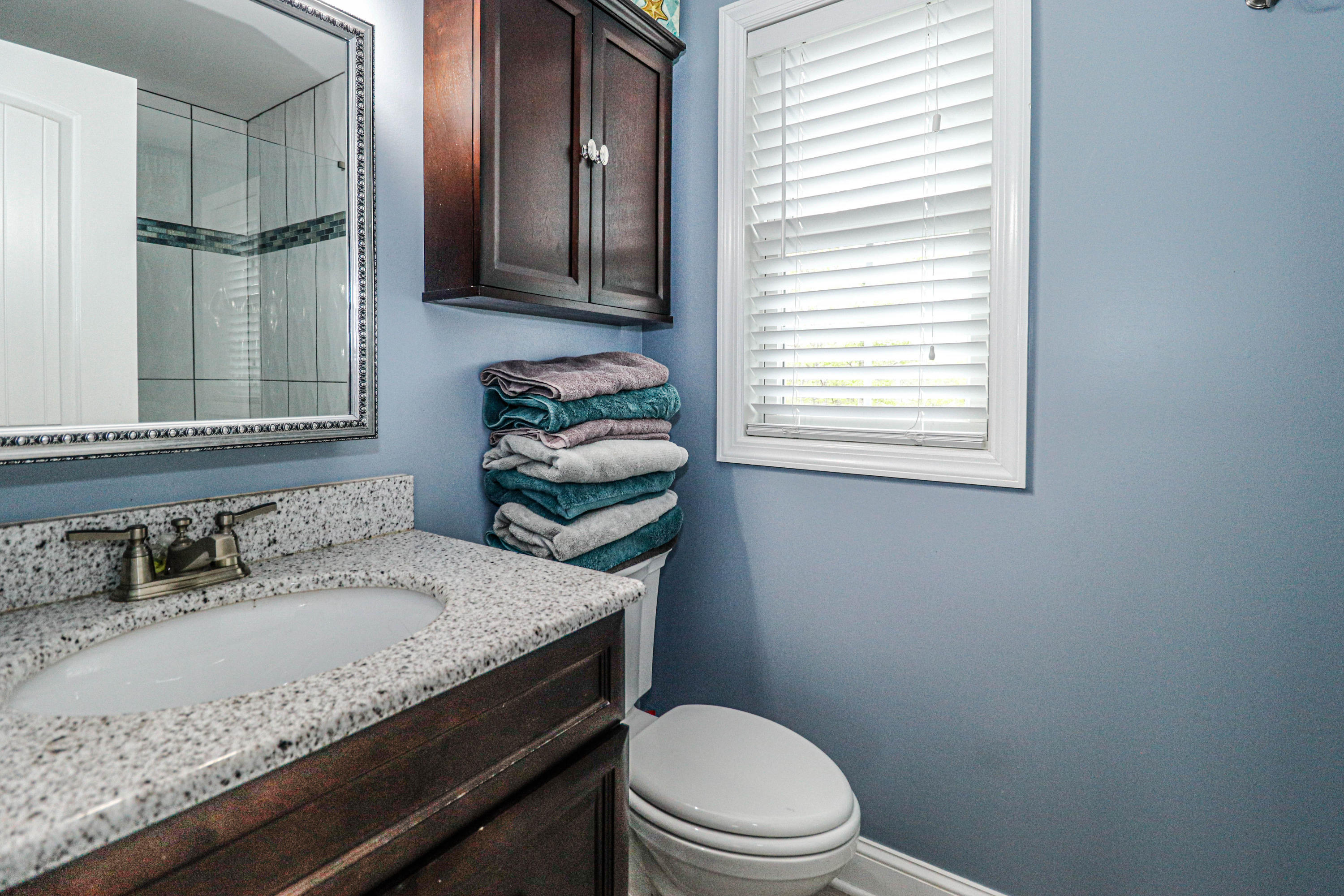 10 Letts Landing Road Waretown, NJ 08758 - Photo 28 of 51 a bathroom with a granite countertop toilet sink and mirror