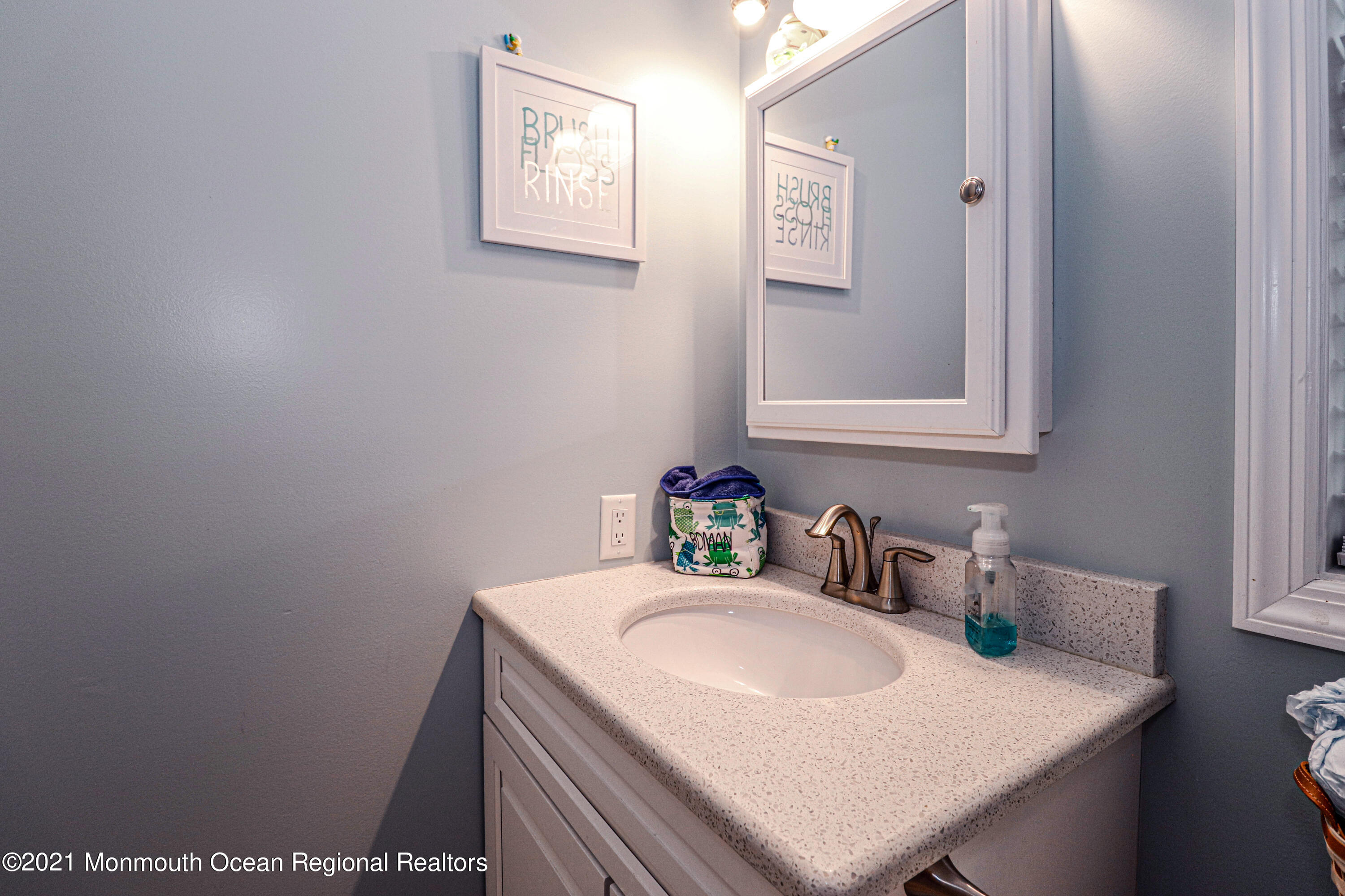 10 Letts Landing Road Waretown, NJ 08758 - Photo 35 of 51 a bathroom with a sink and a mirror