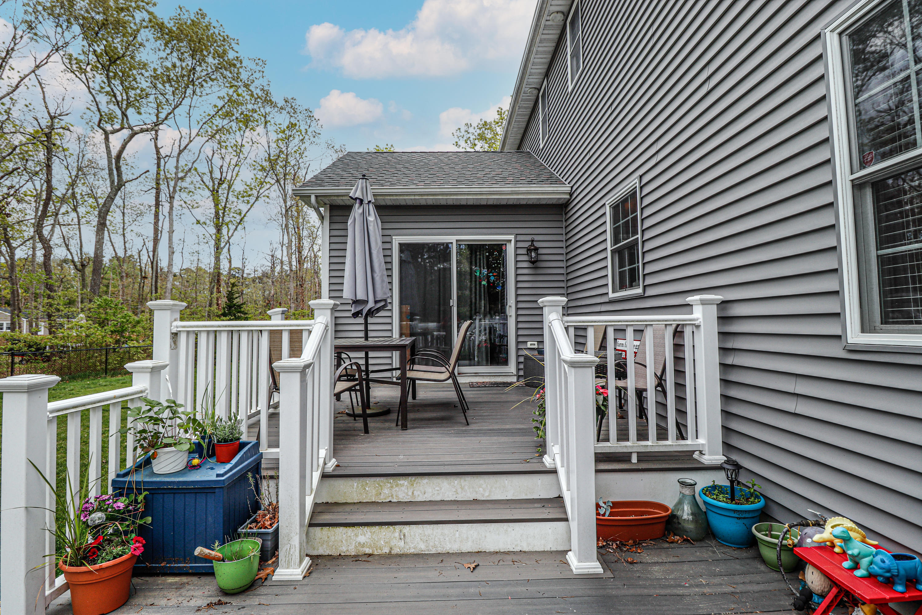 10 Letts Landing Road Waretown, NJ 08758 - Photo 37 of 51 a view of a dinning room with wooden walls and stairs
