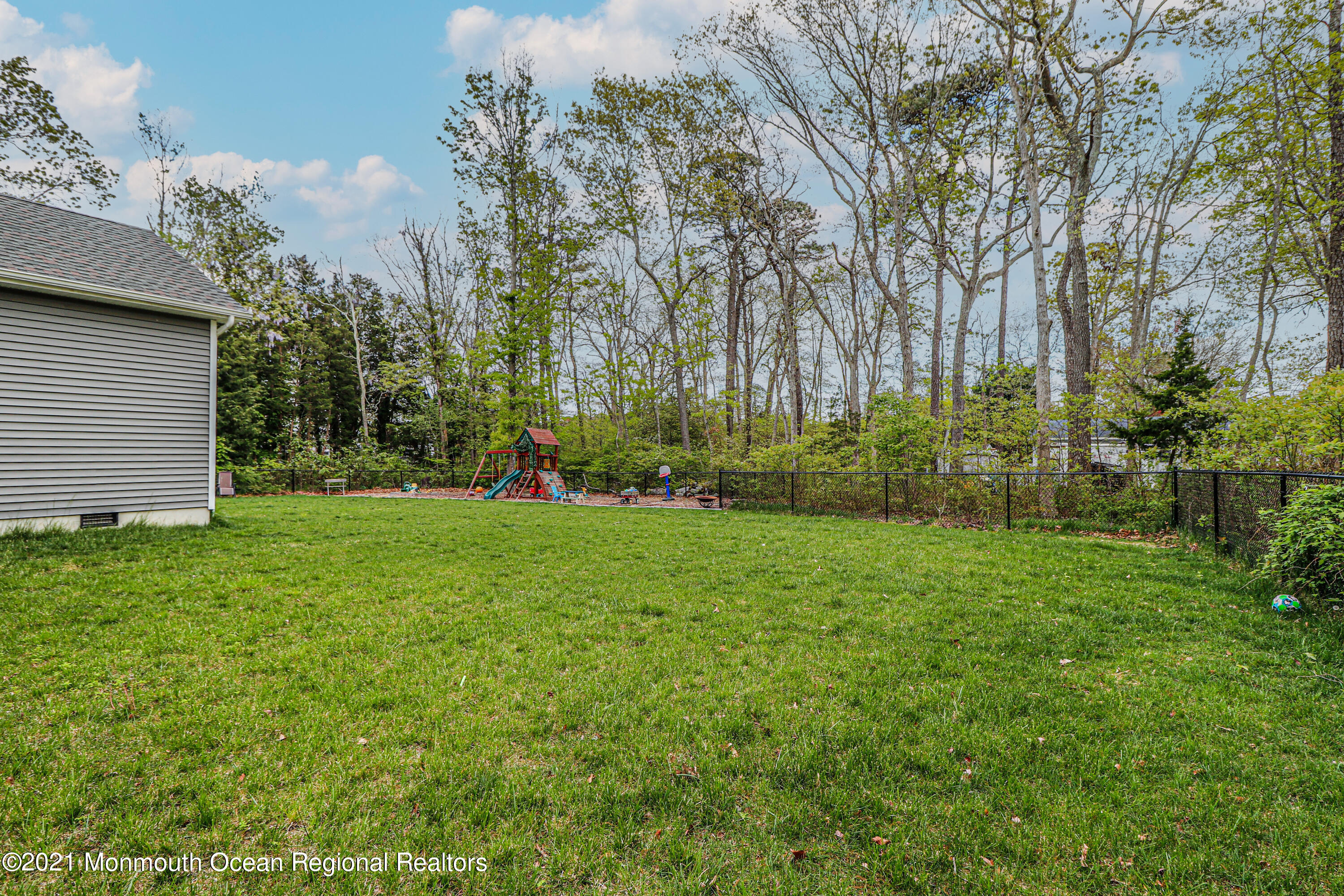 10 Letts Landing Road Waretown, NJ 08758 - Photo 41 of 51 a view of a backyard with large trees
