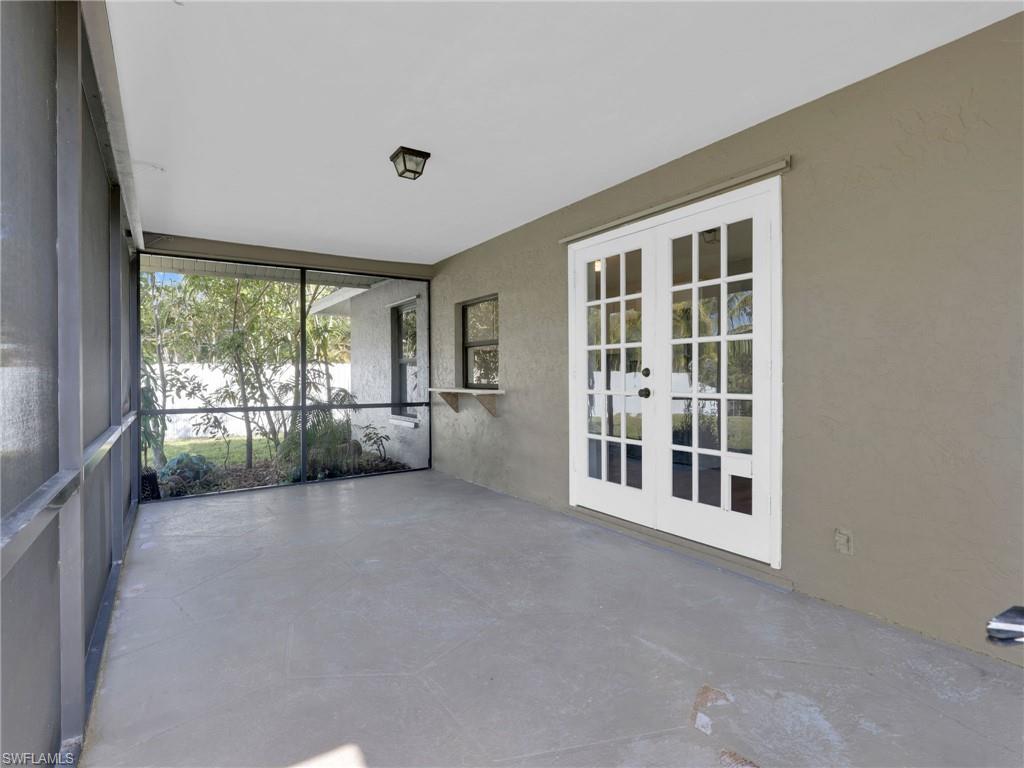 4991 18th Court Southwest Naples, FL 34116 - Photo 25 of 36 an empty room with windows