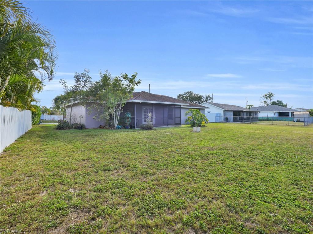 4991 18th Court Southwest Naples, FL 34116 - Photo 29 of 36 a house view with swimming pool in front of it