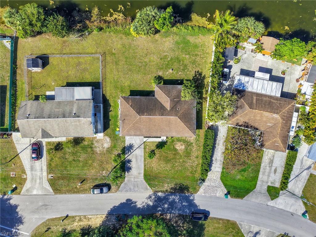 4991 18th Court Southwest Naples, FL 34116 - Photo 33 of 36 an aerial view of residential houses with outdoor space