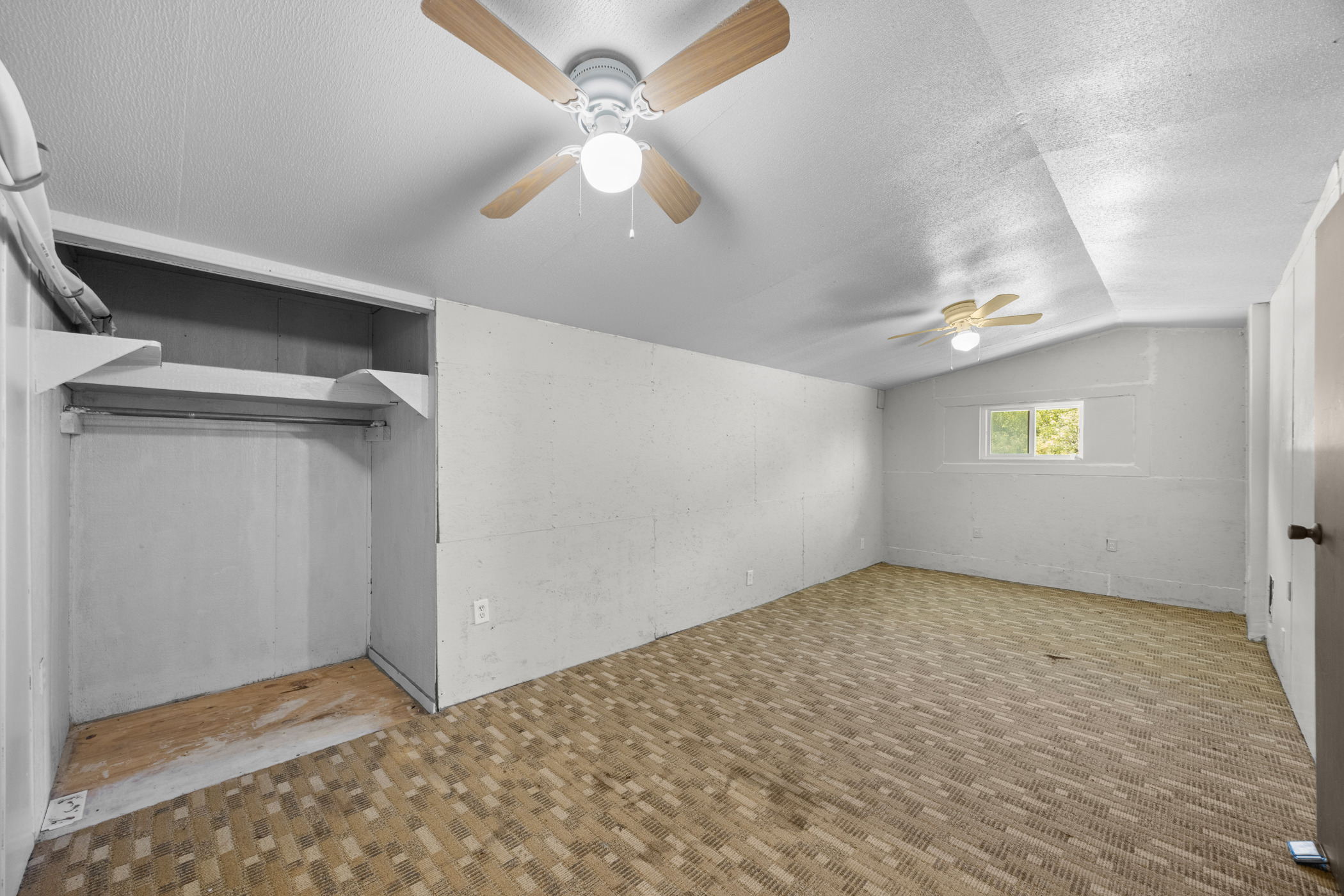 147 Community Center Road Rosanky, TX 78953 - Photo 17 of 33 Unfurnished bedroom with ceiling fan and carpet floors