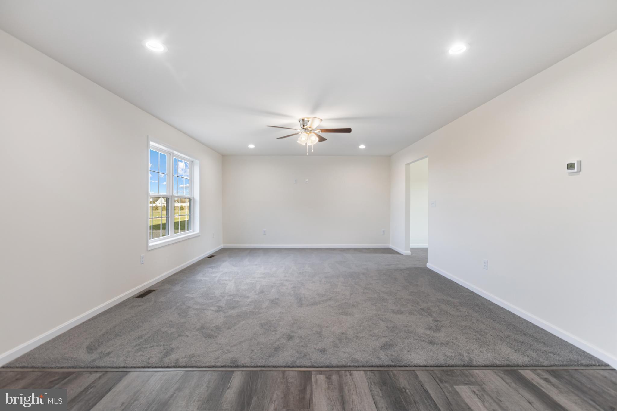 21625 Hackney Circle Lincoln, DE 19960 - Photo 18 of 46 an empty room with windows and fan