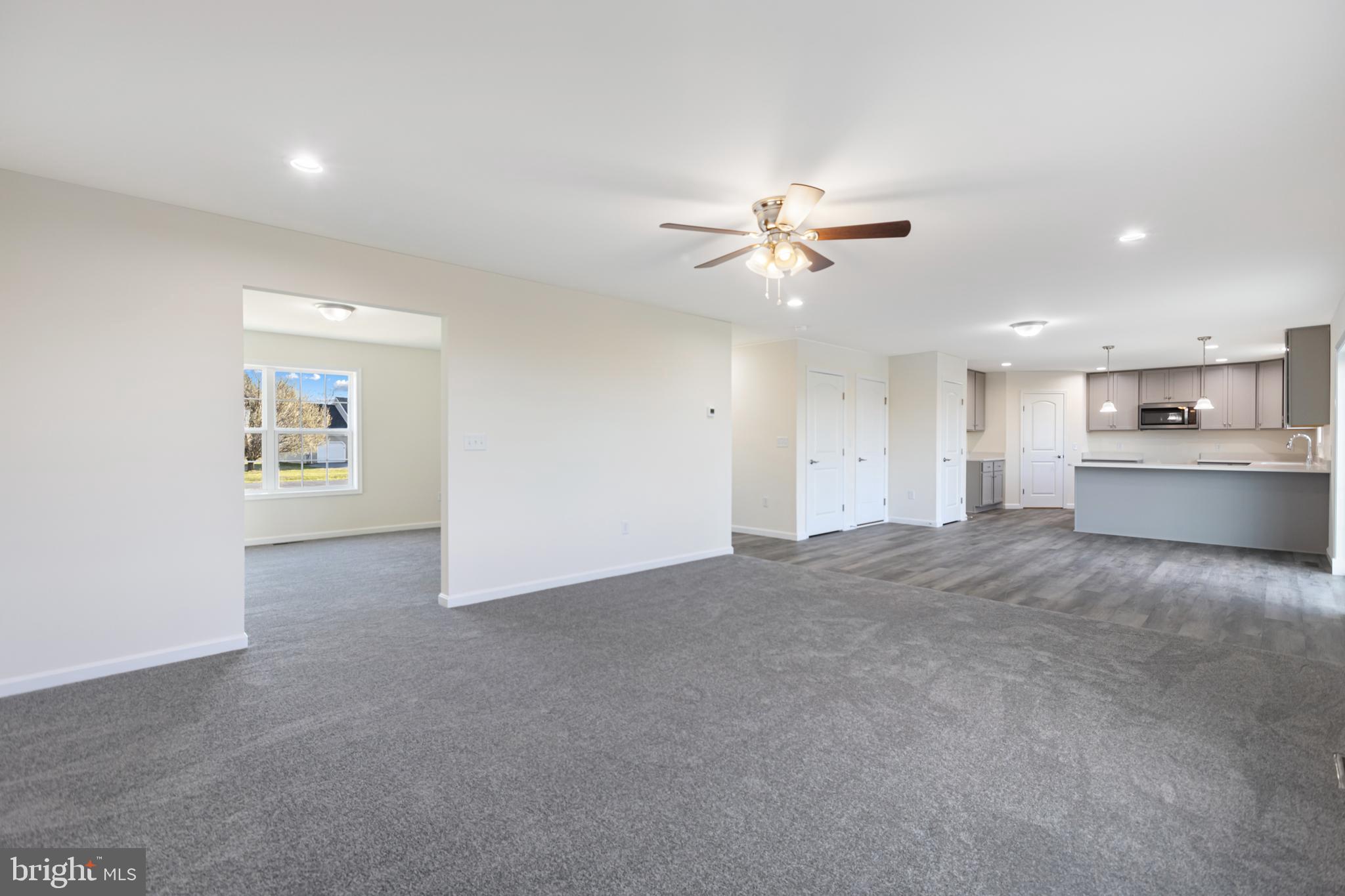 21625 Hackney Circle Lincoln, DE 19960 - Photo 19 of 46 a view of a kitchen with a ceiling fan and a kitchen view