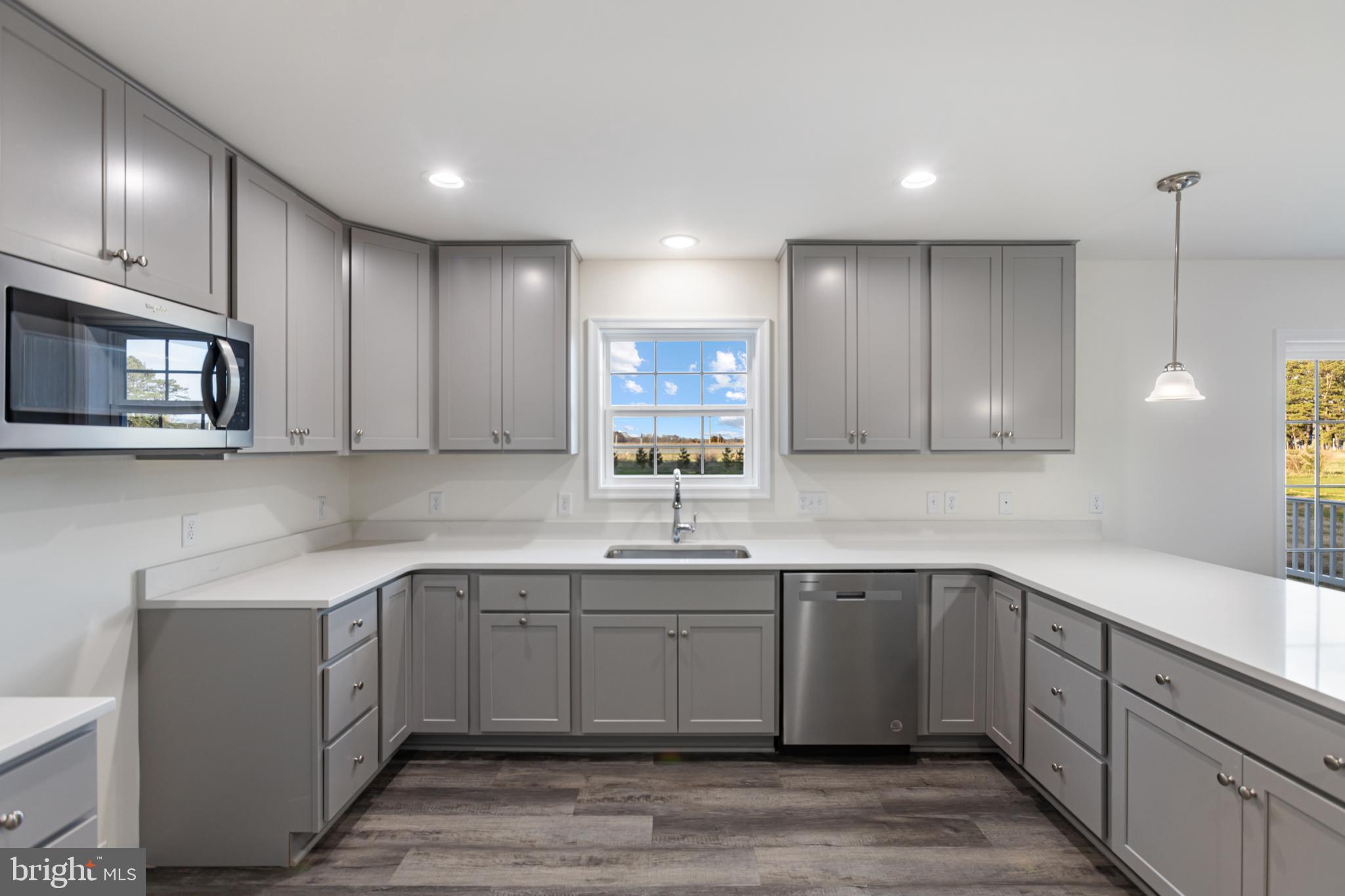 21625 Hackney Circle Lincoln, DE 19960 - Photo 25 of 46 a kitchen with a sink cabinets and window
