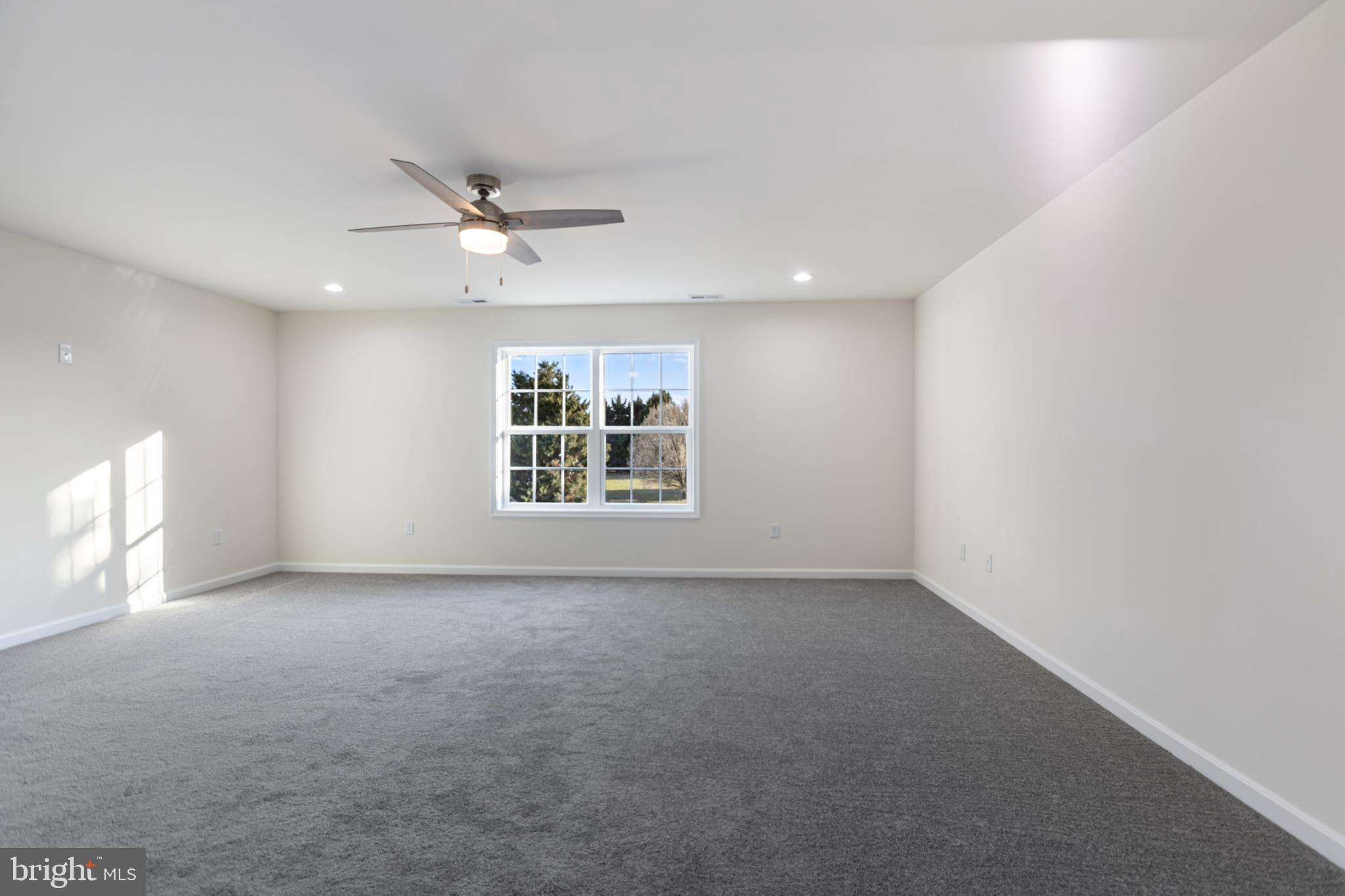 21625 Hackney Circle Lincoln, DE 19960 - Photo 30 of 46 an empty room with windows and fan