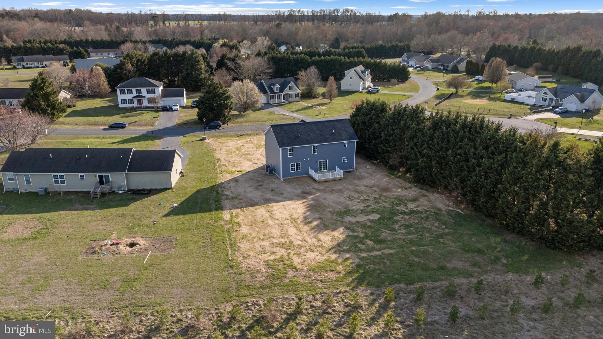 21625 Hackney Circle Lincoln, DE 19960 - Photo 6 of 46 a view of a lake with a houses