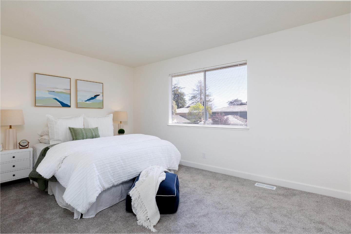 4475 Diamond Street, Unit 3 Capitola, CA 95010 - Photo 17 of 36 a bedroom with a bed and painting on the wall