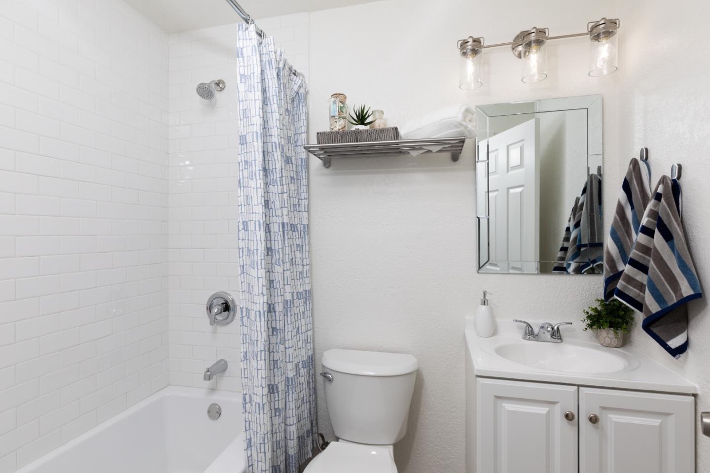4475 Diamond Street, Unit 3 Capitola, CA 95010 - Photo 21 of 36 a bathroom with a sink a toilet and a tub