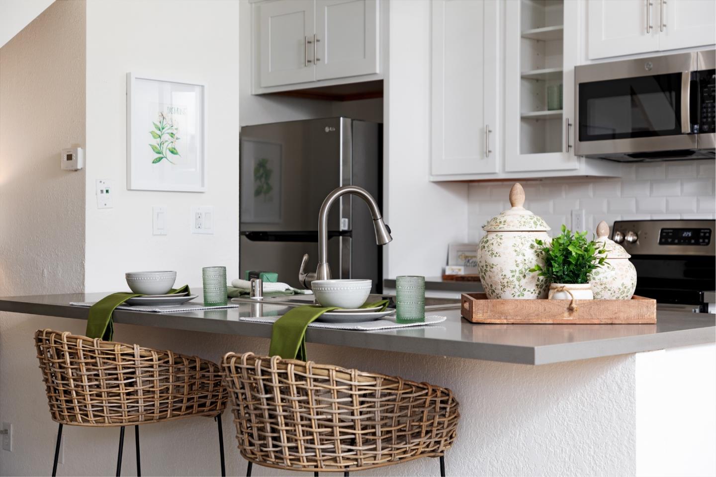 4475 Diamond Street, Unit 3 Capitola, CA 95010 - Photo 9 of 36 a kitchen with a table chairs and a microwave