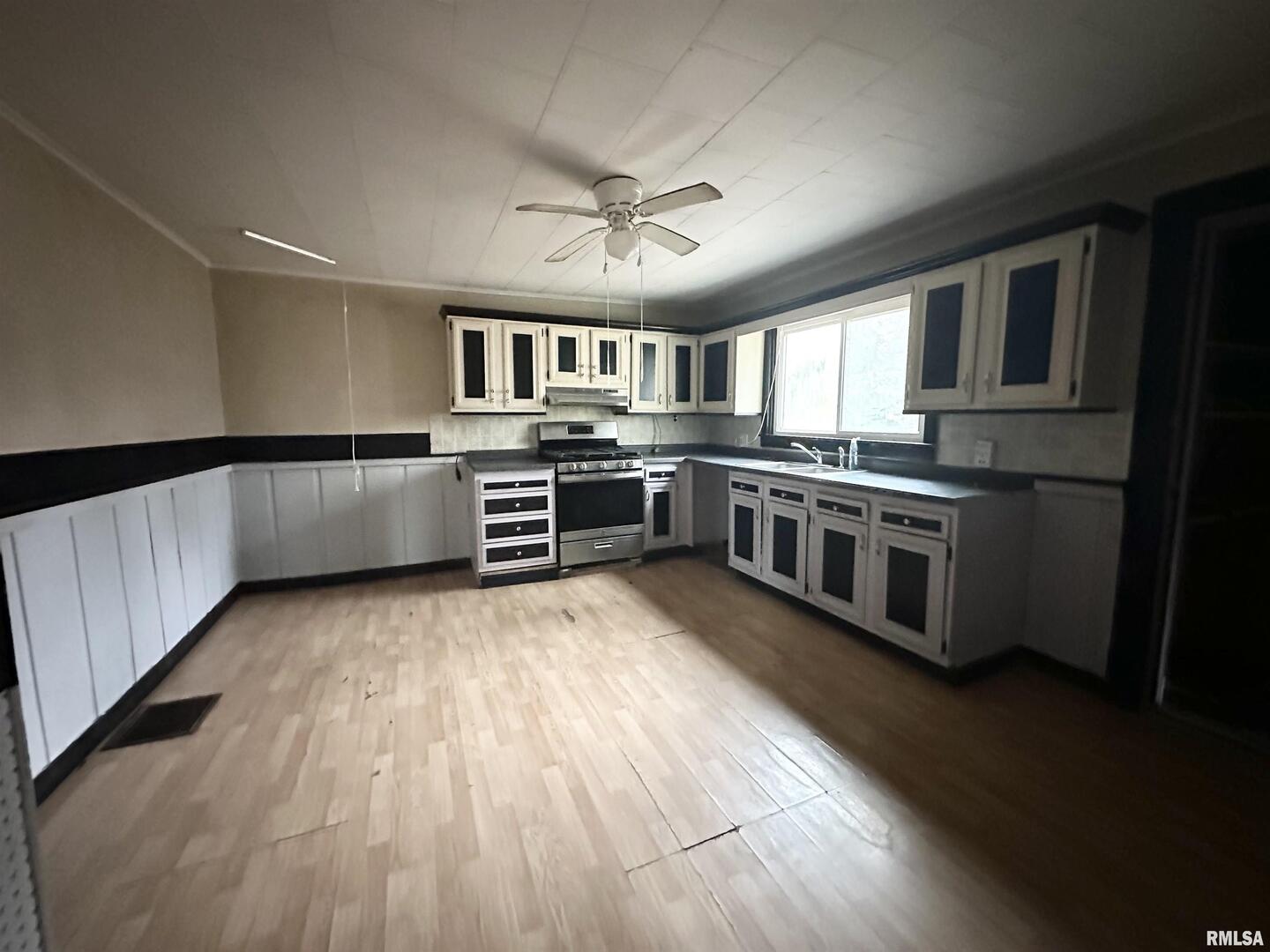 103 East 11th Street Belle Rive, IL 62810 - Photo 12 of 25 a kitchen with stainless steel appliances granite countertop a stove and cabinets