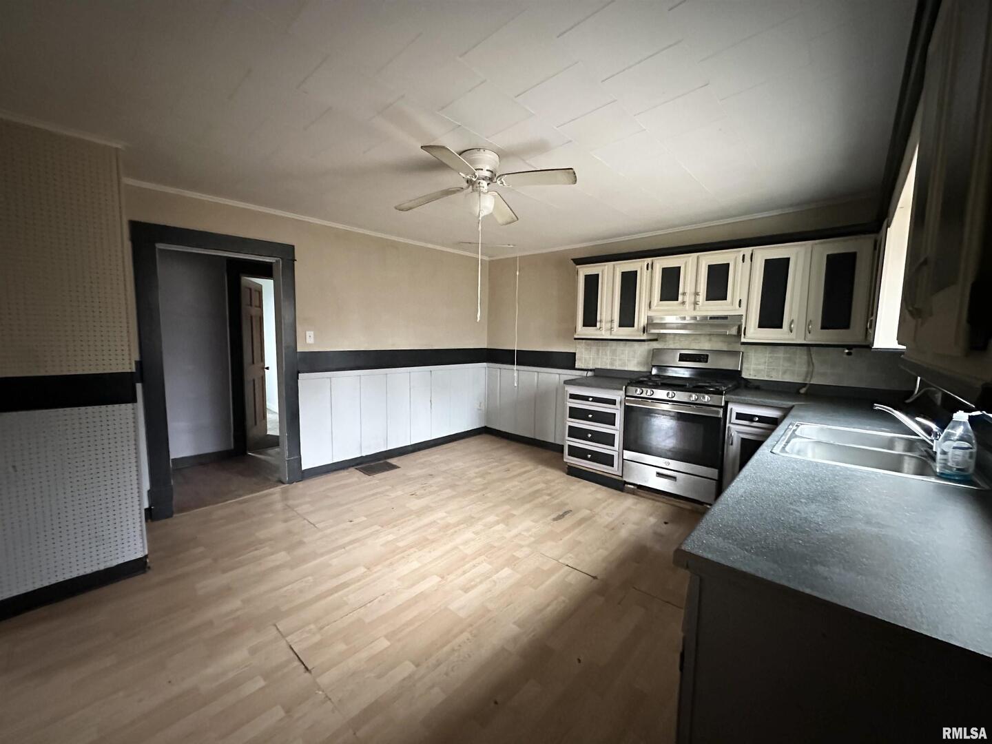 103 East 11th Street Belle Rive, IL 62810 - Photo 14 of 25 a kitchen with stainless steel appliances granite countertop a stove a sink and a refrigerator