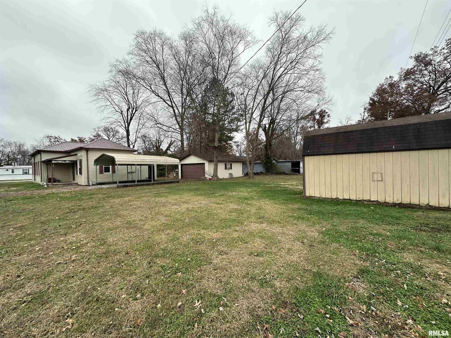 103 East 11th Street Belle Rive, IL 62810 - Photo 10 of 25 a front view of a house with a garden
