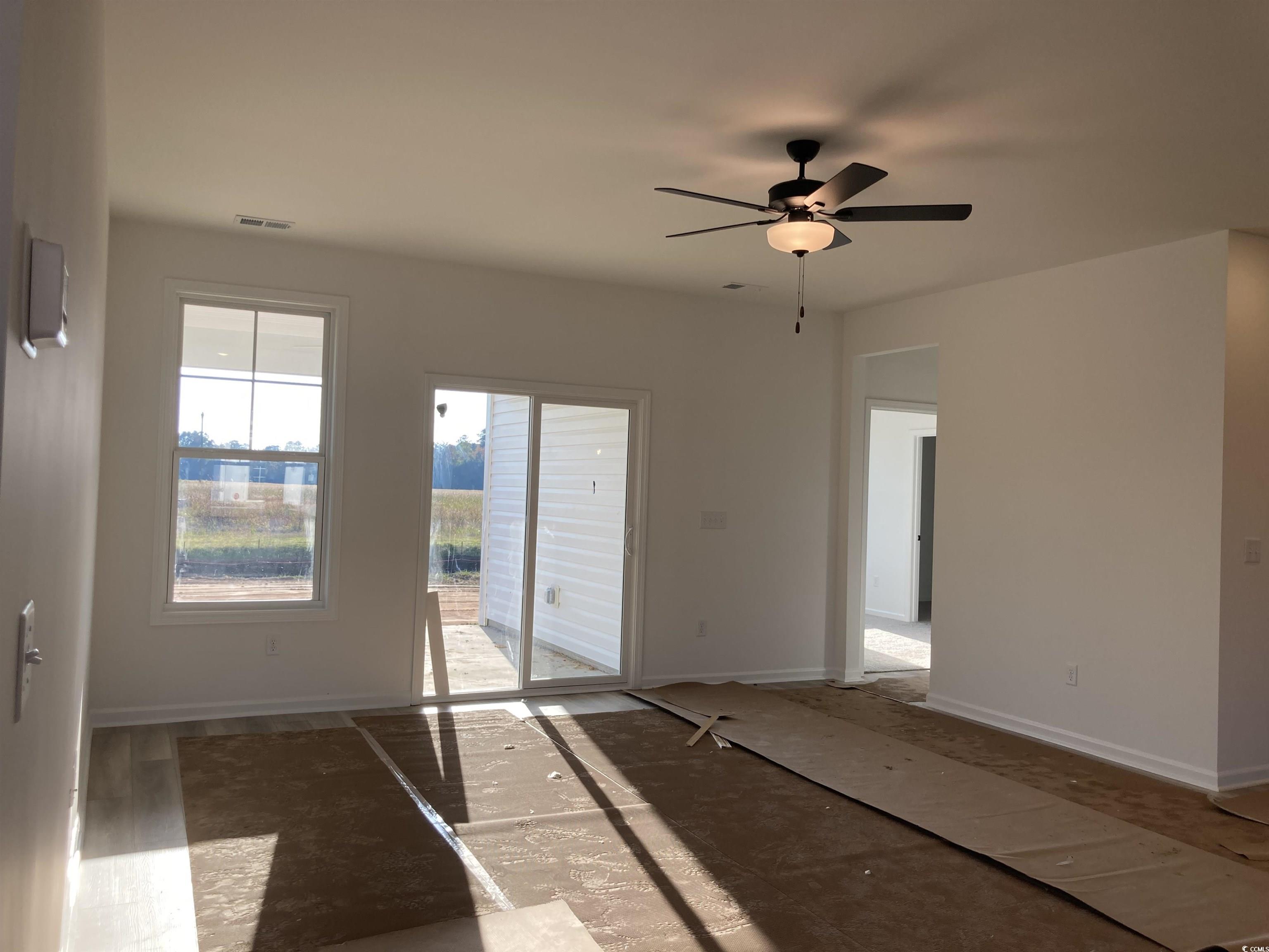 137 River Birch Drive Loris, SC 29569 - Photo 8 of 17 Spare room with baseboards and ceiling fan