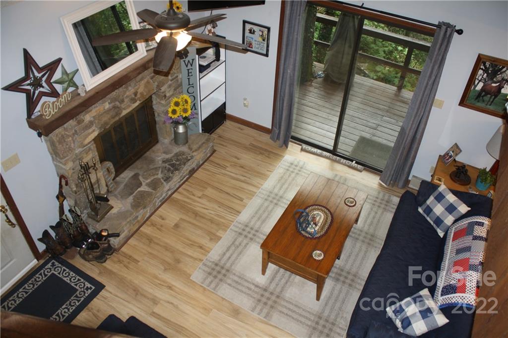 33 Fernbrook Road Maggie Valley, NC 28751 - Photo 16 of 36 a view of living room with furniture and a fireplace