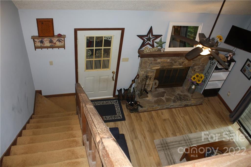 33 Fernbrook Road Maggie Valley, NC 28751 - Photo 17 of 36 a living room with furniture and a fireplace