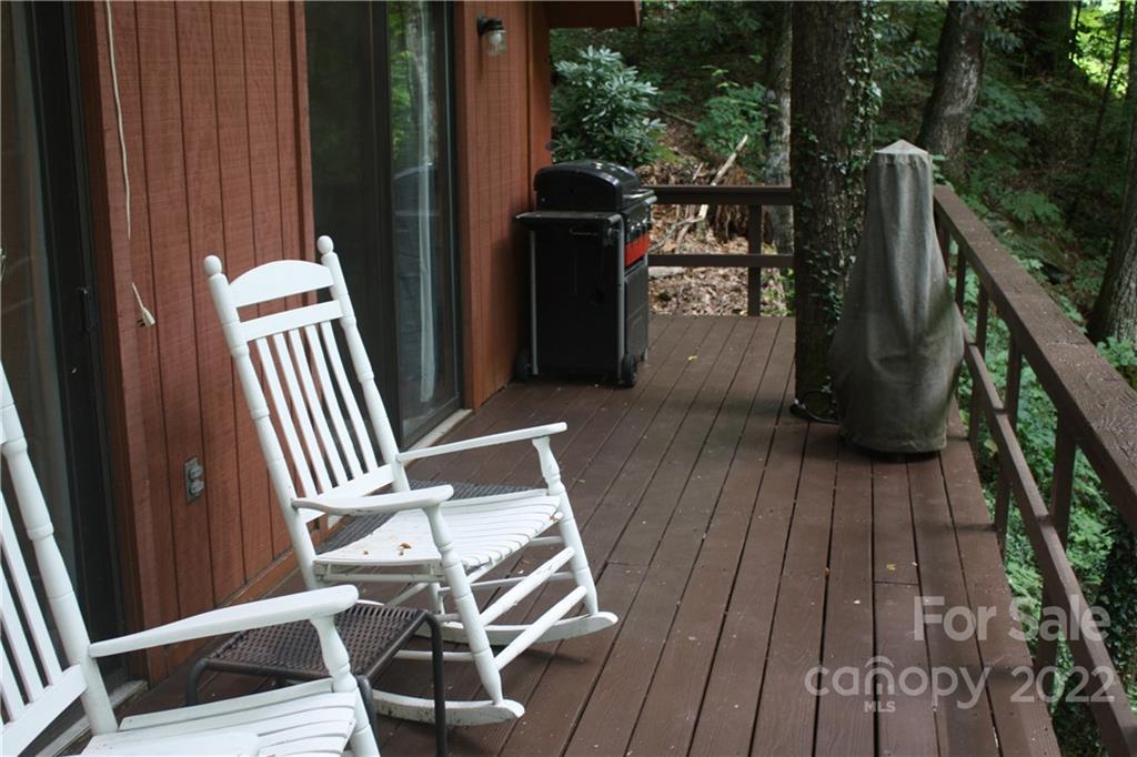 33 Fernbrook Road Maggie Valley, NC 28751 - Photo 21 of 36 a view of deck with wooden floor and outdoor seating