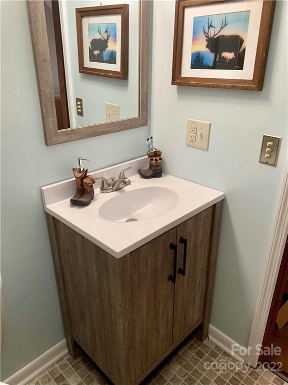 33 Fernbrook Road Maggie Valley, NC 28751 - Photo 28 of 36 a bathroom with a sink and a mirror