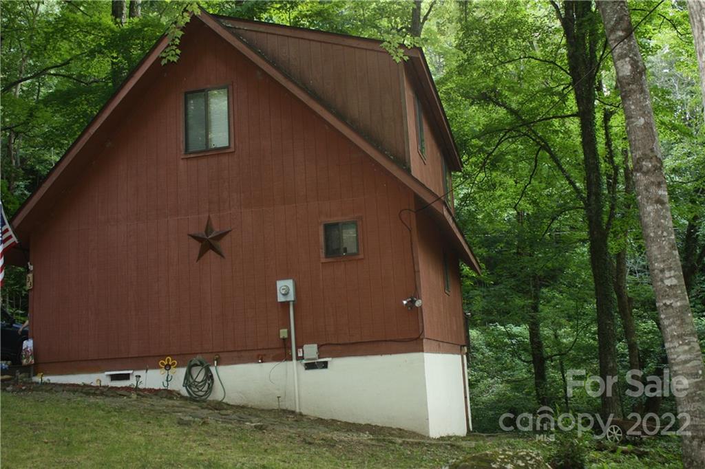 33 Fernbrook Road Maggie Valley, NC 28751 - Photo 33 of 36 a house with trees in the background