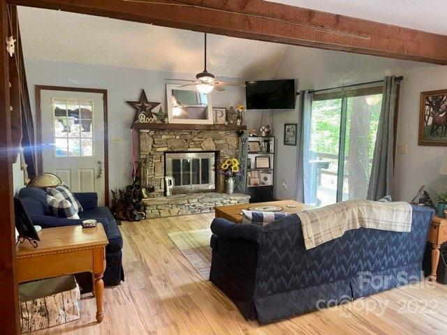 33 Fernbrook Road Maggie Valley, NC 28751 - Photo 35 of 36 a living room with furniture and a fireplace