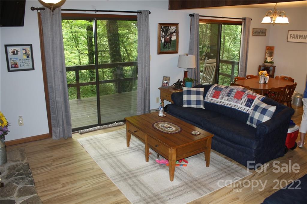 33 Fernbrook Road Maggie Valley, NC 28751 - Photo 10 of 36 a living room with furniture and a window