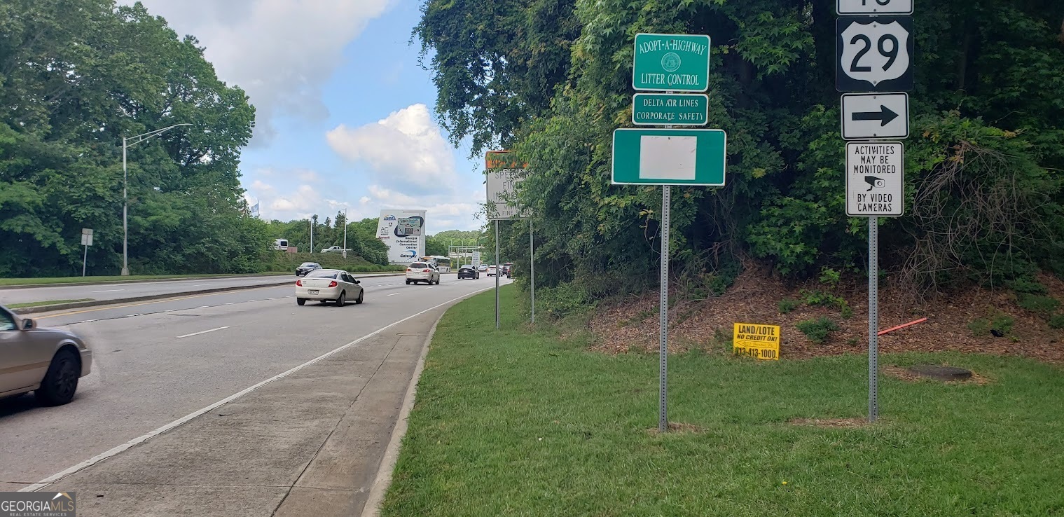 4122 Herschel Road College Park, GA 30337 - Photo 2 of 7 a view of a street with a car parked beside of it