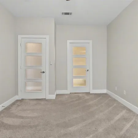 a view of an empty room and window