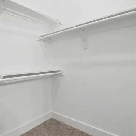 a view of an empty walk in closet