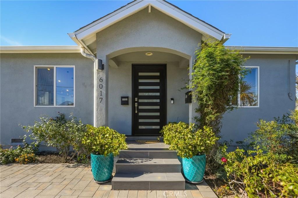6017 Encino Encino, CA 91316 - Photo 1 of 51 a front view of a house with a garden