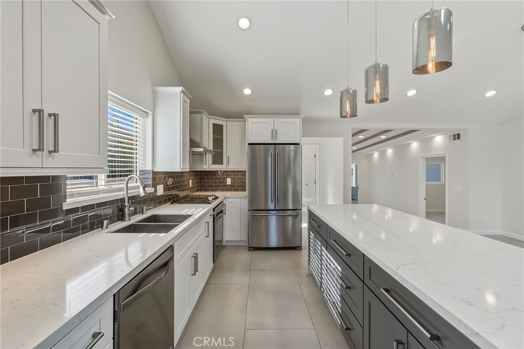 6017 Encino Encino, CA 91316 - Photo 13 of 51 a kitchen with a sink stove and refrigerator