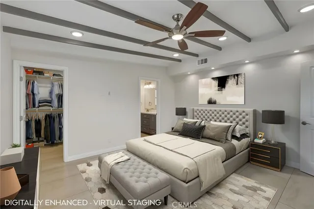 a bedroom with a large bed and a couch