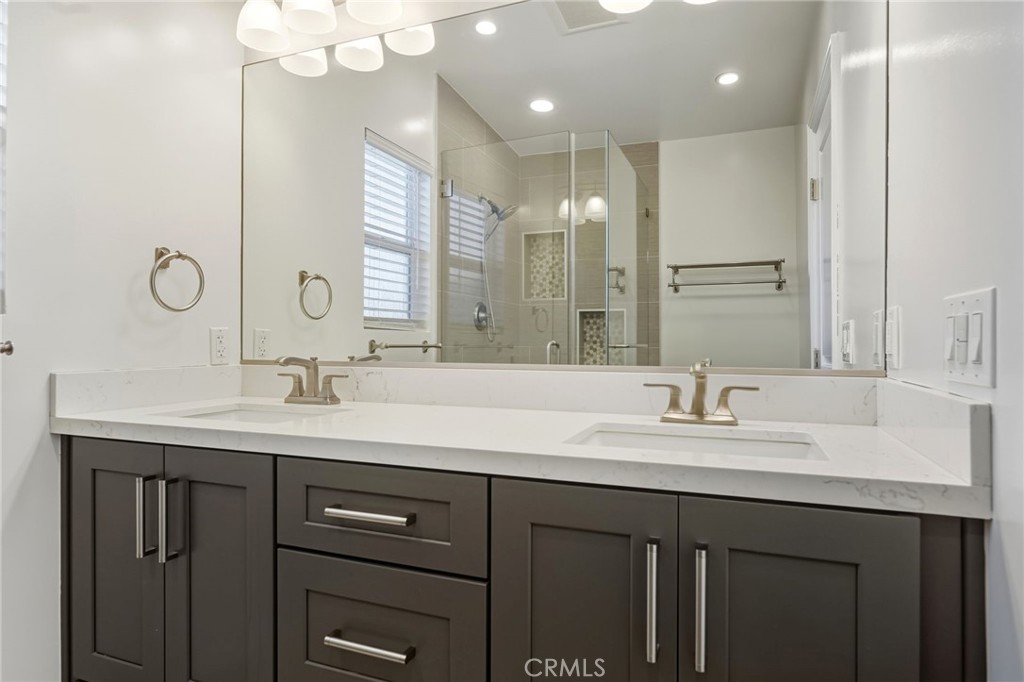 6017 Encino Encino, CA 91316 - Photo 22 of 51 a bathroom with a double vanity sink and a mirror