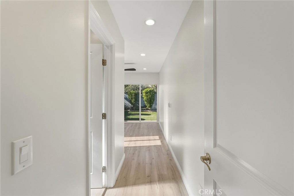 6017 Encino Encino, CA 91316 - Photo 24 of 51 a view of a hallway with wooden floor and a window