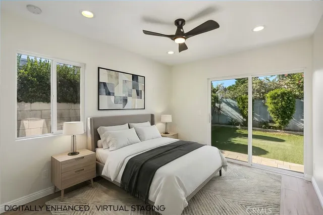 a bedroom with a large bed and a large window