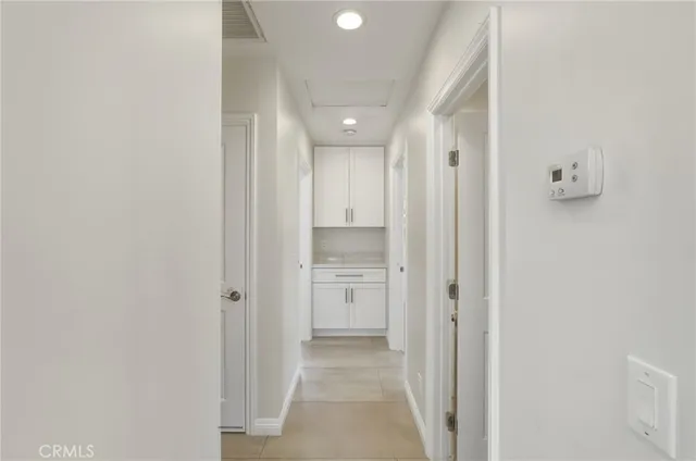 a bathroom with a granite countertop sink