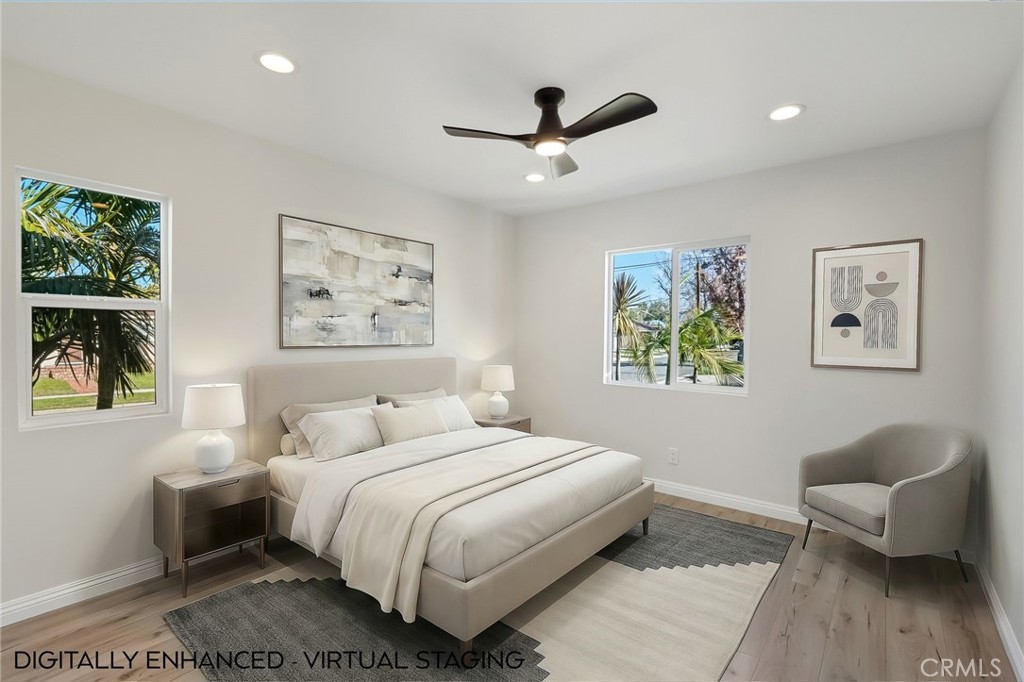 6017 Encino Encino, CA 91316 - Photo 30 of 51 a bedroom with a bed and a painting on the wall