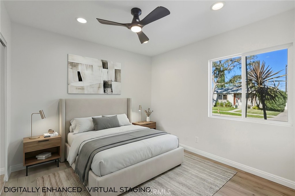 6017 Encino Encino, CA 91316 - Photo 31 of 51 a bedroom with a bed and a painting on the wall